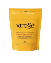 Yellow package of 60 Xtresse hair growth gummies on a transparent background